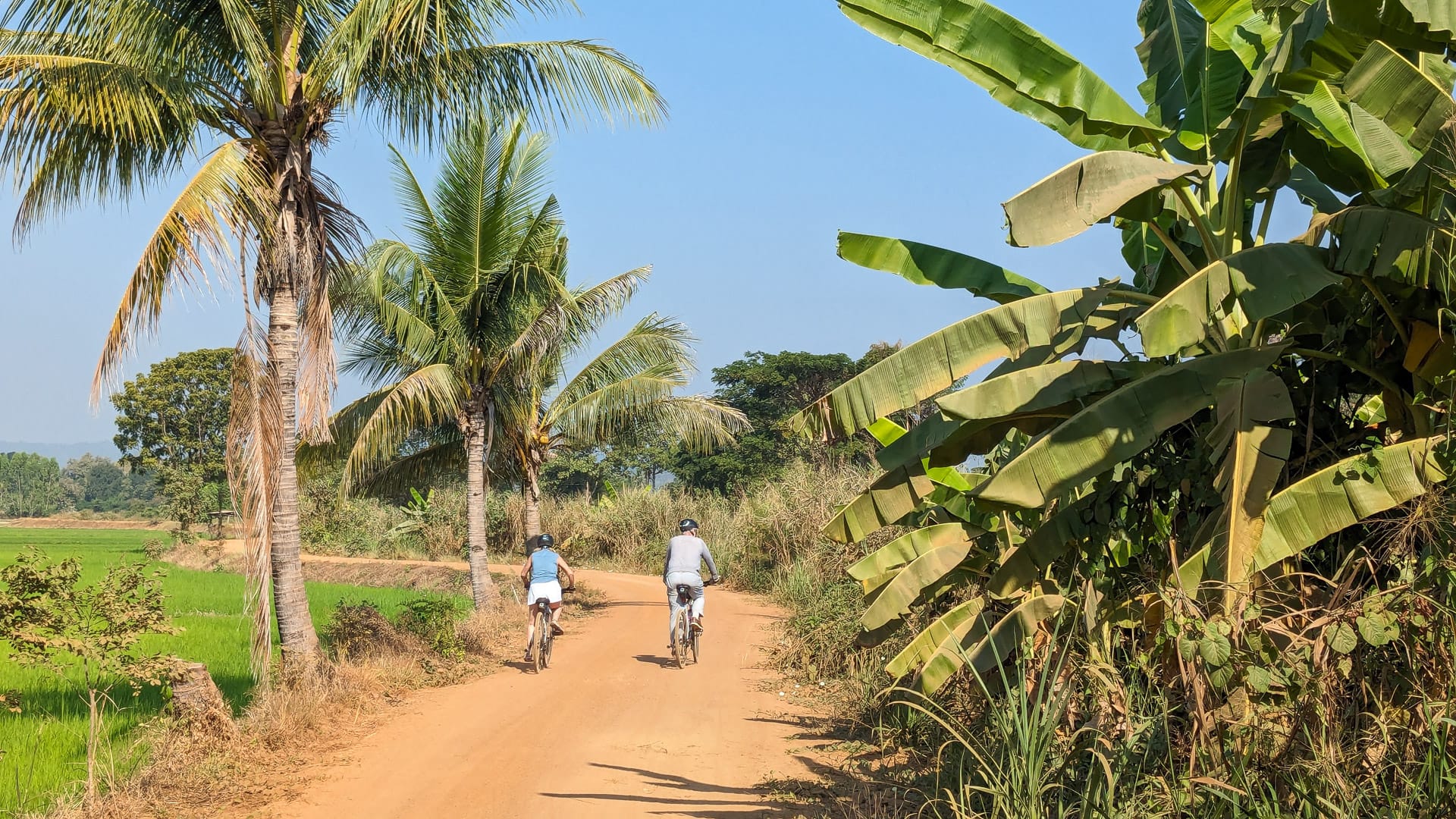 Cycling gravel roads near Si Satchanalai in Uttaradit, surrounded by peaceful countryside.