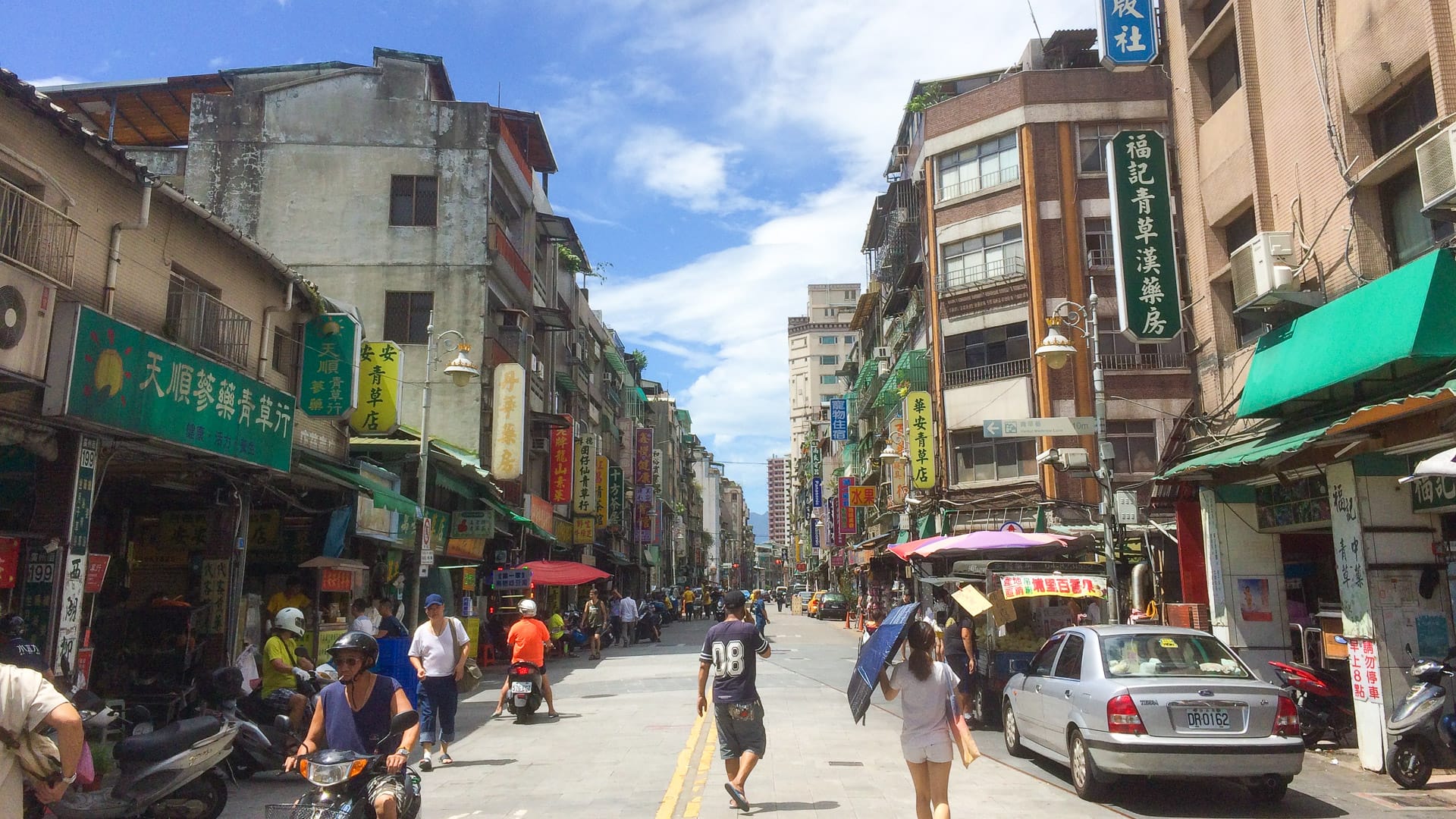 Busy street lined with shops and local businesses in Taipei, Taiwan