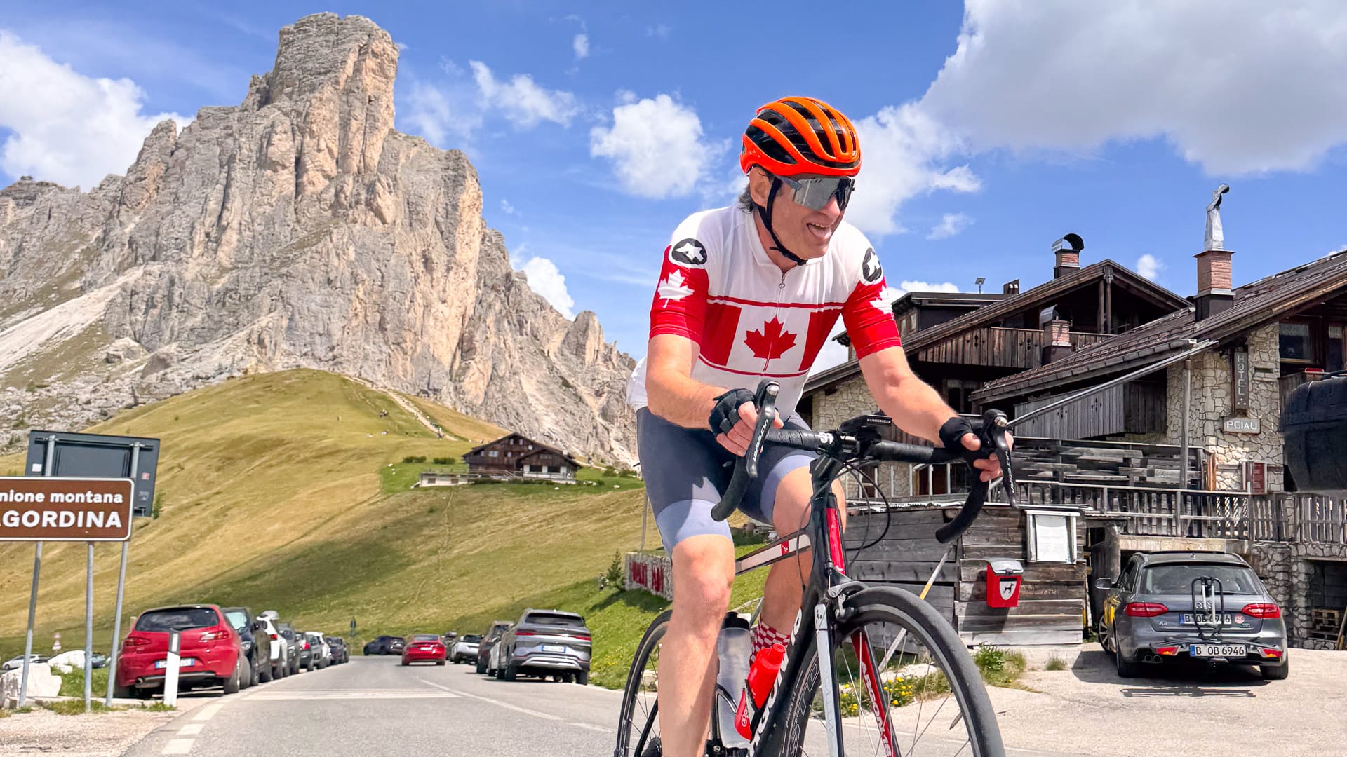 Cyclist on a bucket-list climb of Passo Giau in the Dolomites