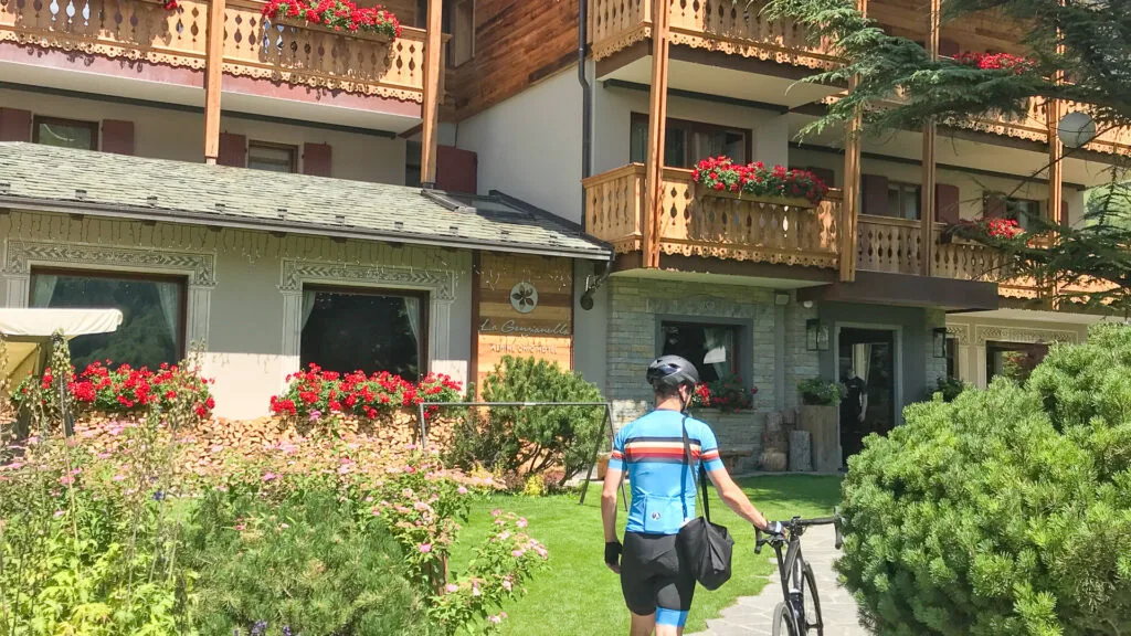 Cycling walking into a cycling hotel in Italy